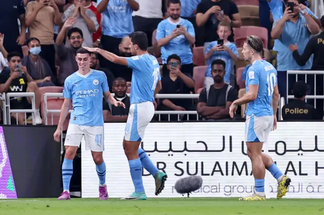 Phil Fiden, Rodri and Jack Grealish celebrate