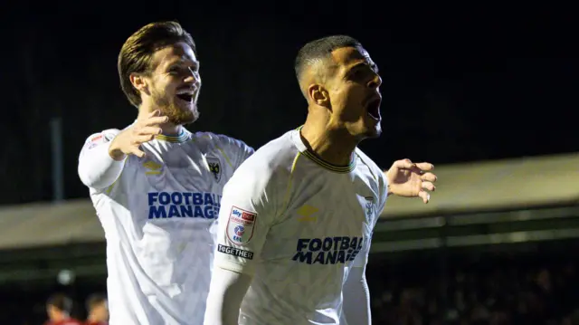 Ali Al-Hamadi celebrates scoring for AFC Wimbledon at Crawley