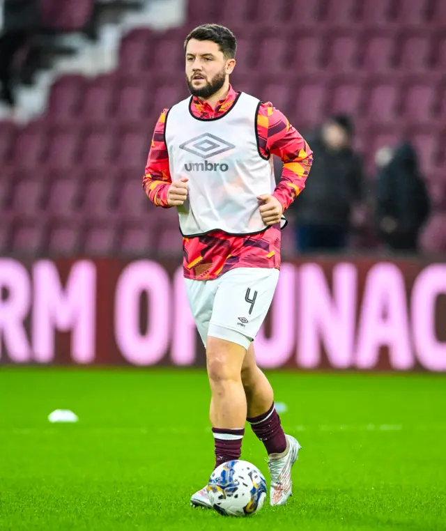 Craig Halkett warms up at Tynecastle