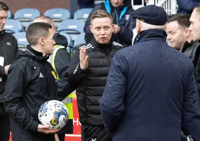 Barry Robson chats to referee David Munro