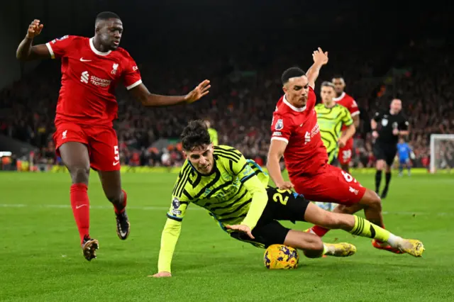 Havertz falls to the floor in the box under pressure from Gomez and Alexander Arnold.