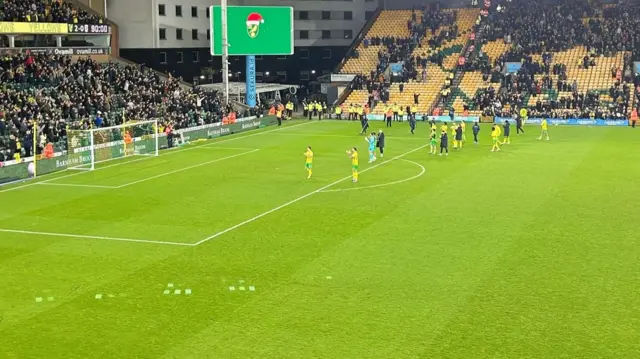 Norwich players clap fans