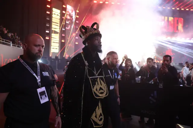 Deontay Wilder in a crown and robe