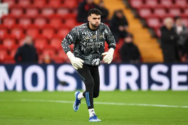 Raya jogs during the warm up at Anfield.