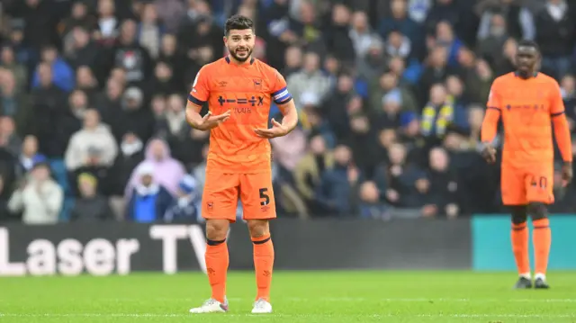 Ipswich captain Sam Morsy tries to encourage his side