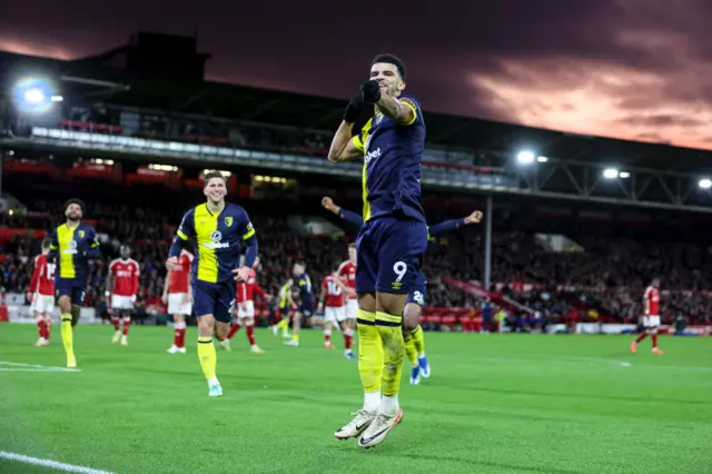 Dominic Solanke does his archer celebration after scoring a third of the game.