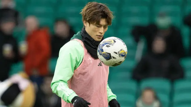 Celtic striker Kyogo warming up