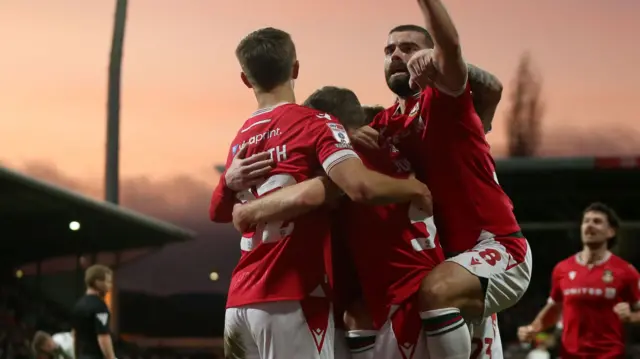 Wrexham celebrate a goal against Newport