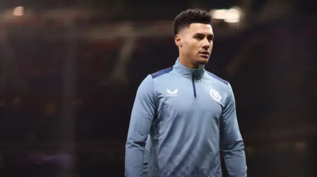 Ollie Watkins warms up at Odl Trafford.