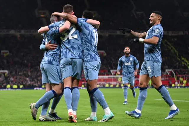 Villa players celerbate the first goal at the corner flag.