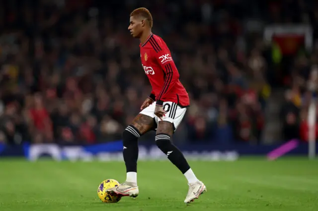 Rashford has the ball at his feet.