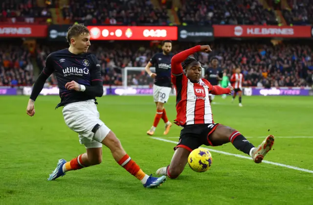 Luton Town's Alfie Doughty in action with Sheffield United's Andre Brooks