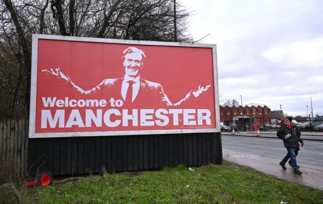 A billboard near Old Trafford shows a picture of Sir Jim Ratcliffe