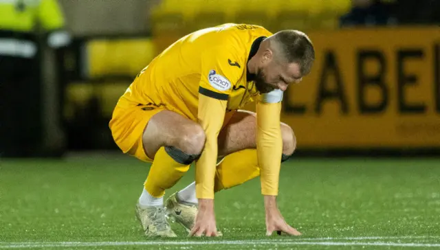 Livingston captain Mikey Devlin looks dejected