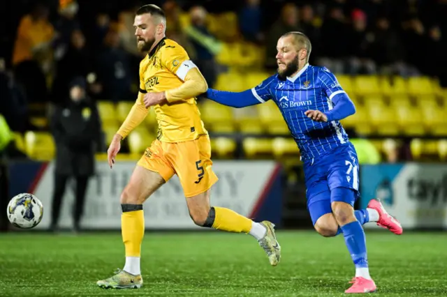 Battle for possession between Stevie May and Mikey Devlin