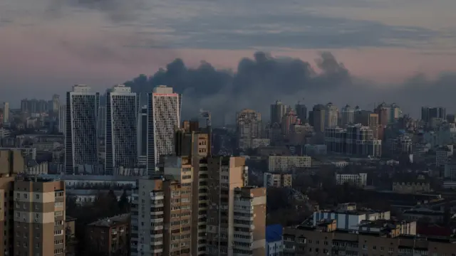 Smoke rises over the Ukrainian capital Kyiv after Russian missile and drone attacks