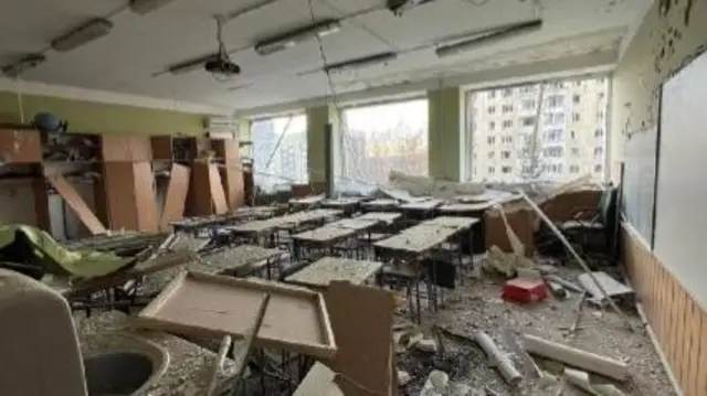 Damage in room that appears to be a school classroom