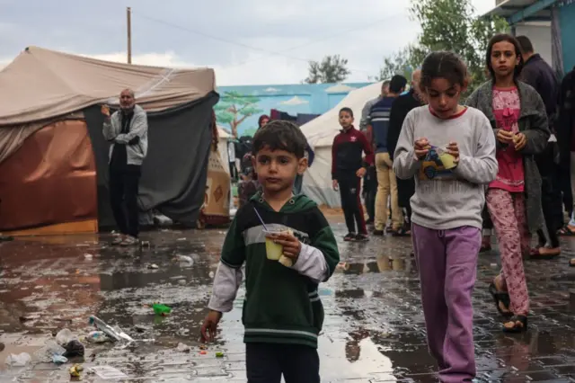 Internally displaced Palestinian children living in a school run by the UN agency for Palestinian refugees are seen in the picture taken on 15 November 2023