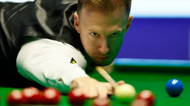 Judd Trump attempts to pot a red