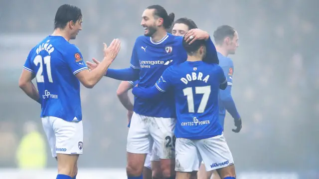 Chesterfield players celebrate a goal against Leyton Orient