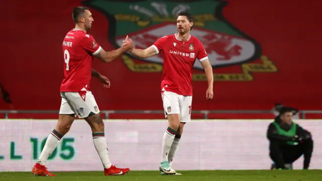 Ollie Palmer (left)  celebrates with Wrexham team-mate George Evans of Wrexham after scoring against Yeovil