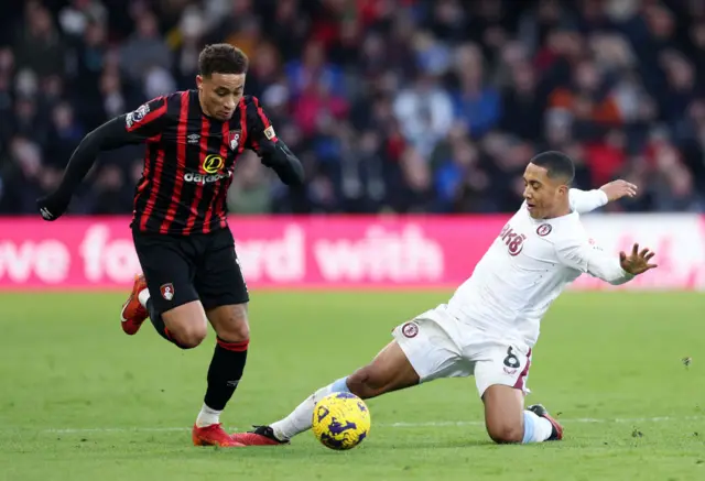 Marcus Tavernier is challenged by Youri Tielemans