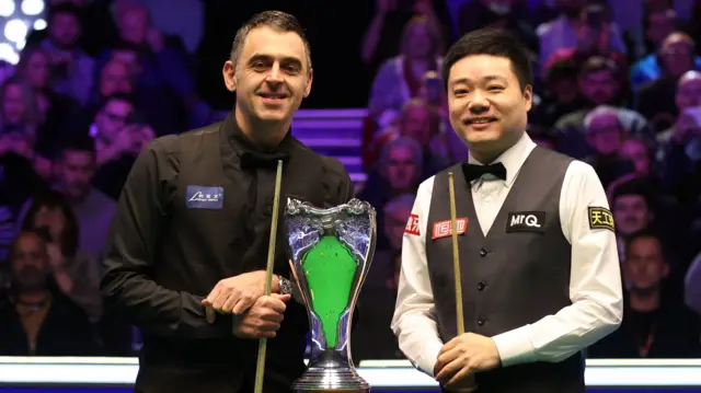 Ronnie O'Sullivan and Ding Junhui with the UK Championship trophy