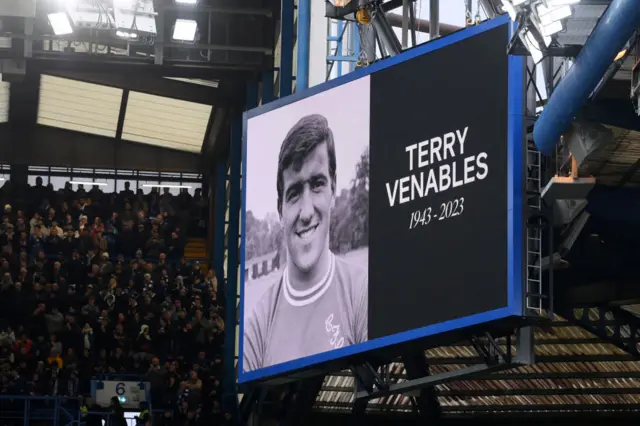 The LED board shows a tribute to the late Terry Venables prior to the Premier League match between Chelsea FC and Brighton & Hove Albion at Stamford Bridge