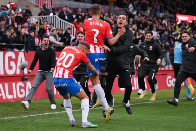 Cristhian Stuani celebrates with his Girona teammates after scoring