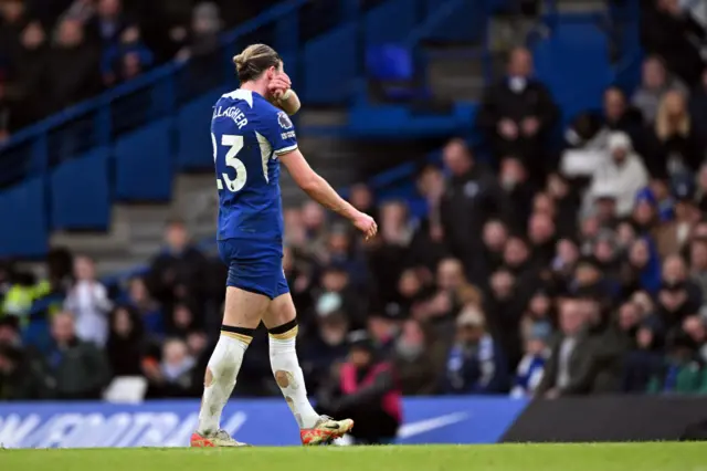 Conor Gallagher leaves the pitch after being shown a red card