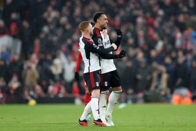 Kenny Tete of Fulham celebrates with teammate Harrison Reed