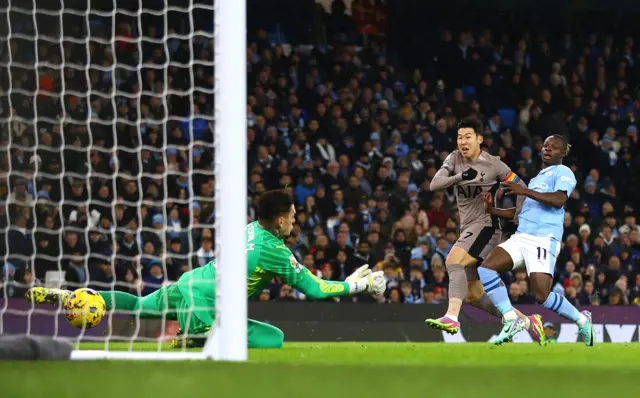 Son Heung-min scores their first goal past Manchester City's Ederson