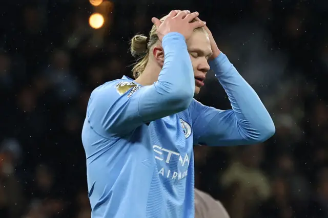 Erling Haaland reacts after missing a chance