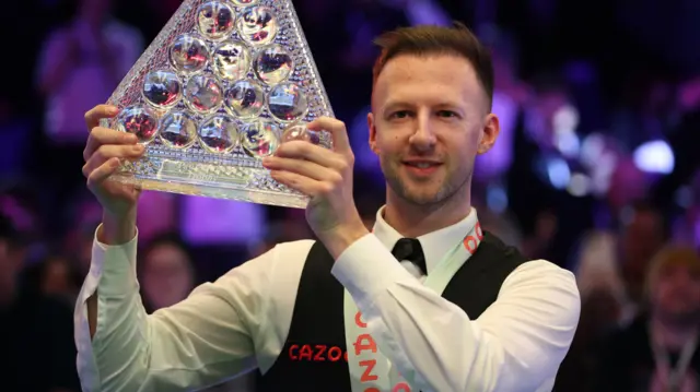 Judd Trump holds the Masters trophy