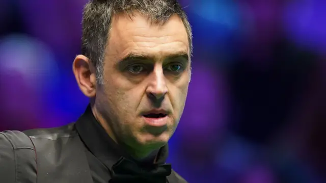 Ronnie O'Sullivan looks on