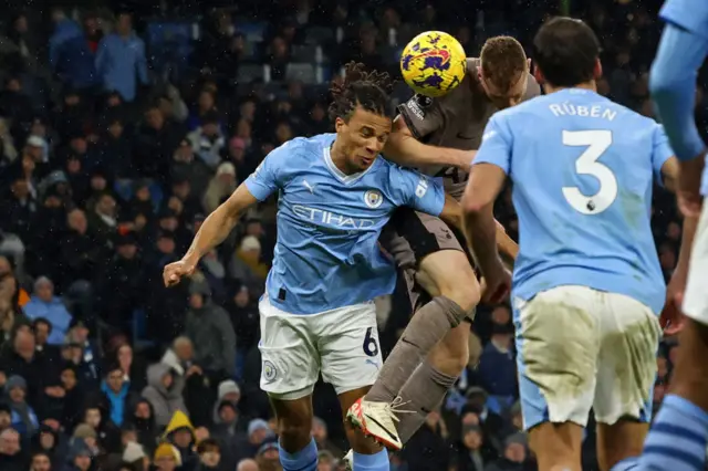 Dejan Kulusevski beats Nathan Ake to this header to make it 3-3