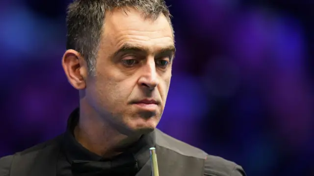 Ronnie O'Sullivan looks on