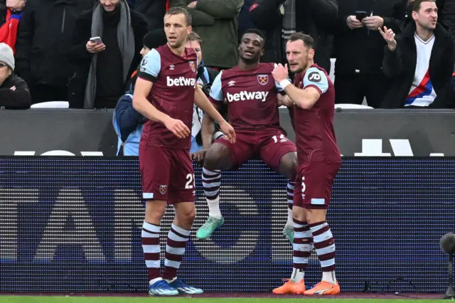 Mohammad Kudas celebrates with Tomas Soucek and Vladimir Coufal after scoring the opening goal