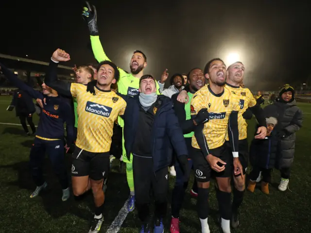 Maidstone players celebrate beating Barrow