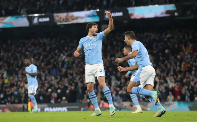 Ruben Dias celebrates