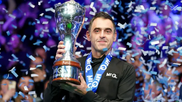 Ronnie O'Sullivan holds the UK Championship trophy