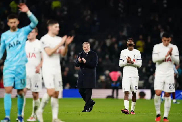 Postecoglou and his players stroll and applaud the fans.