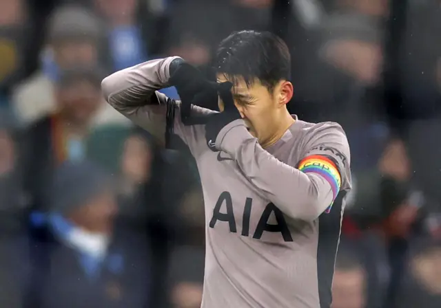 Son Heung-min celebrates scoring their first goal