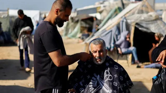 Man having beard trimmed