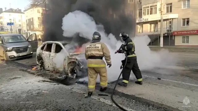 Footage published by Russia's emergency ministry shows burning cars being extinguished by firefighters