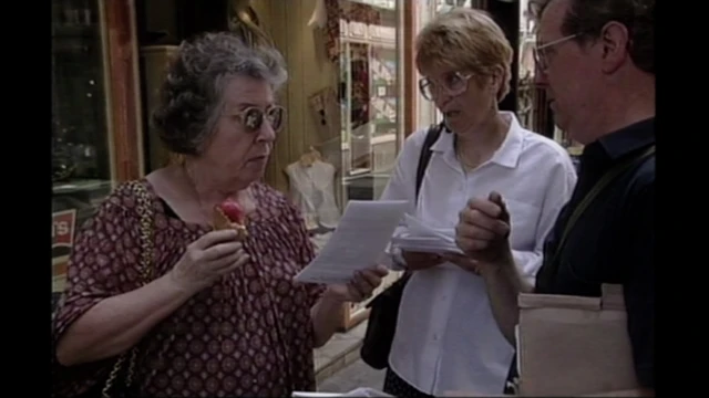 Roger and Pauline giving a leaflet to her woman