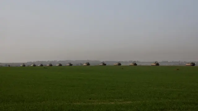 A convoy of Israeli tanks manoeuvers near Israel's border with southern Gaza, amid the ongoing conflict between Israel and the Palestinian Islamist group Hamas, in Israel, December 4, 2023.