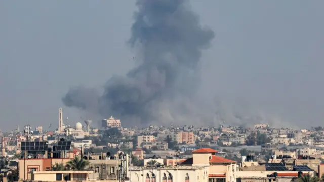 Smoke rises above Khan Younis on 4 December