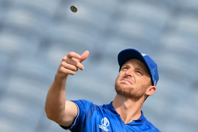 Jos Buttler tosses a coin