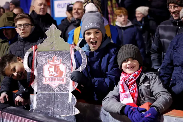 Two young Alfreton fans with a tin foil FA Cup